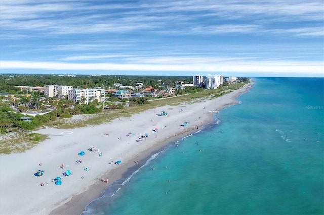 bird's eye view with a water view and a view of the beach