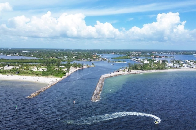 birds eye view of property with a view of the beach and a water view