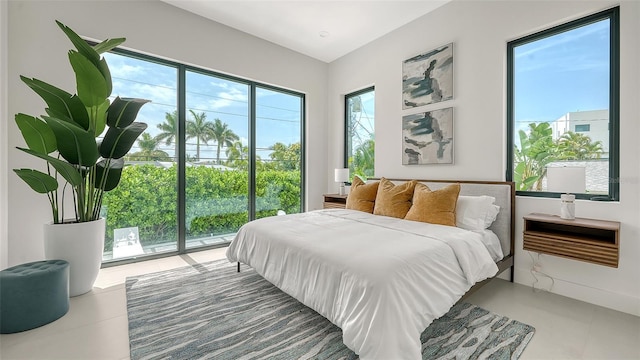 tiled bedroom with access to outside and multiple windows