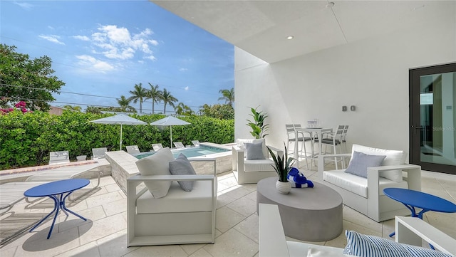 view of patio / terrace with an outdoor hangout area and a hot tub