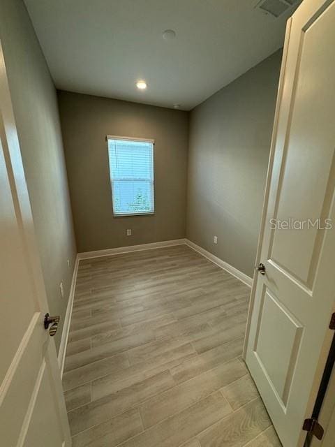 unfurnished room featuring light wood-type flooring