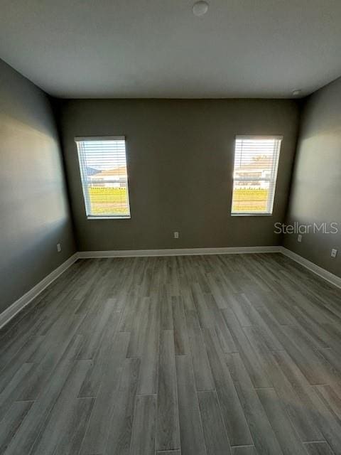 spare room featuring hardwood / wood-style flooring