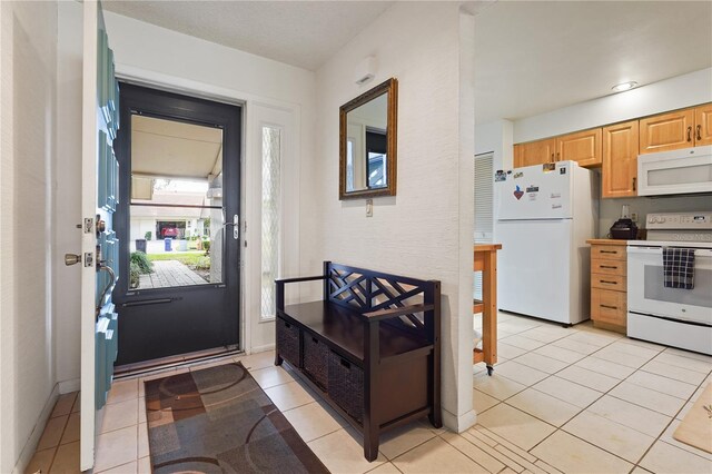 foyer with light tile patterned floors