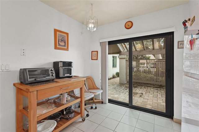 tiled home office featuring a notable chandelier