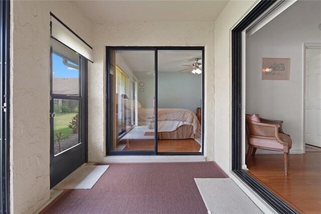 interior space with ceiling fan