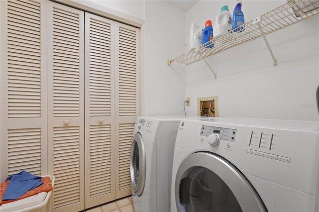 laundry room with washing machine and dryer