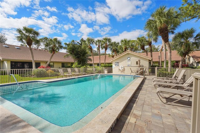 view of swimming pool featuring a patio area