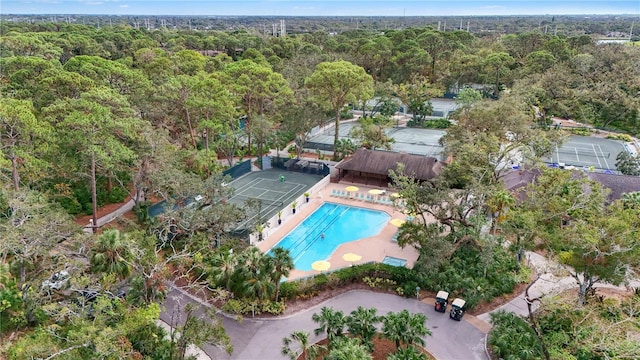 drone / aerial view featuring a view of trees