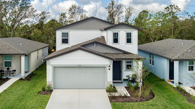 view of property with a garage and a front yard