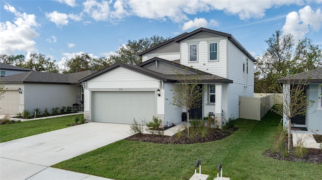 view of front property featuring a garage and a front yard