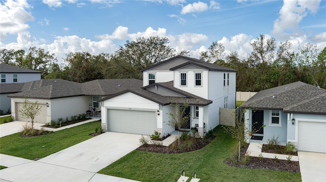 view of front of house with a garage and a front yard