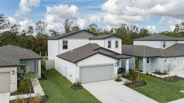 view of front facade with a garage and a front lawn