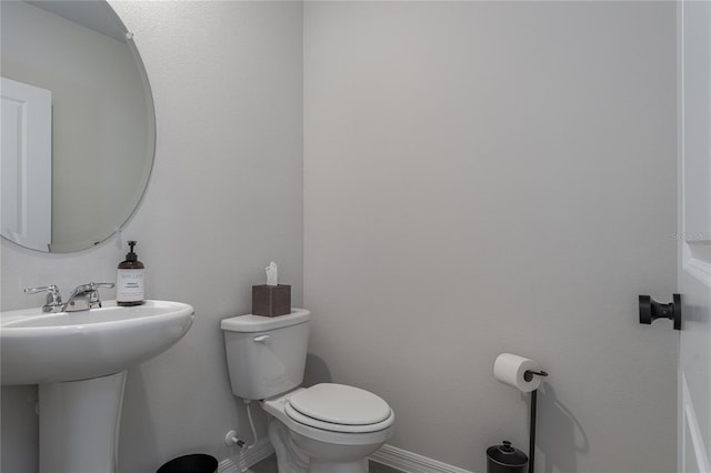 bathroom with sink and toilet