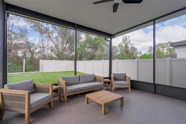 sunroom featuring ceiling fan