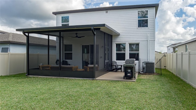 back of house with a sunroom, cooling unit, and a yard