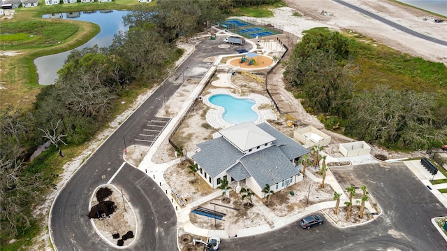 birds eye view of property with a water view