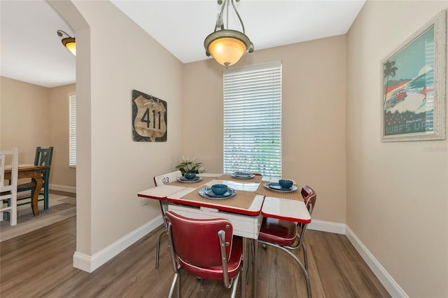 dining space featuring dark hardwood / wood-style floors