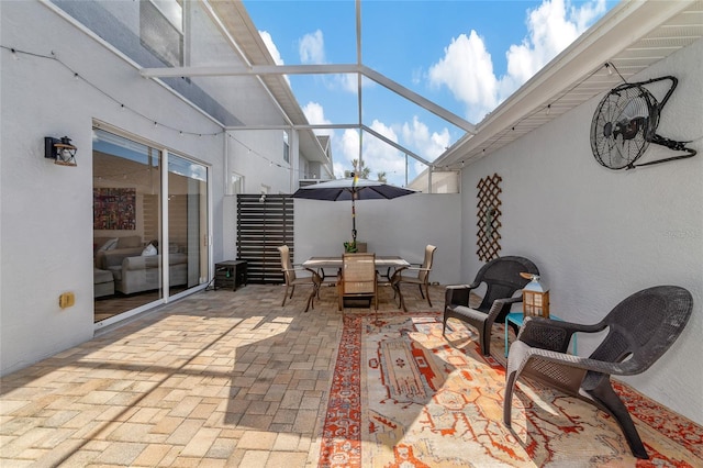 view of patio with a lanai