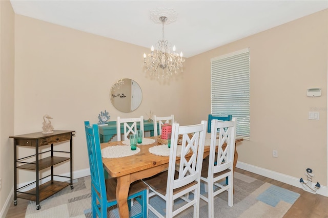 dining area featuring an inviting chandelier