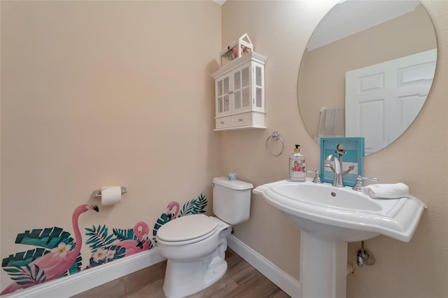 bathroom with wood-type flooring and toilet