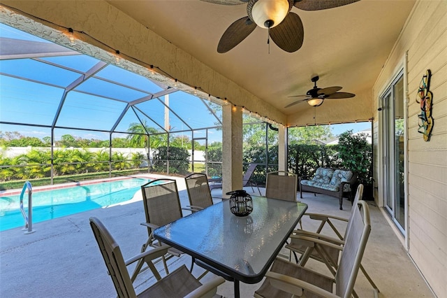 4135 Dover Dr E, Bradenton, FL 34203 - view of patio / terrace with ceiling fan, an outdoor pool, and glass enclosure