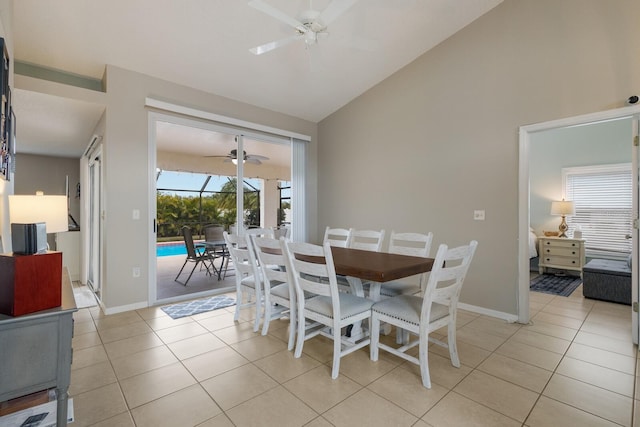 dining space featuring lofted ceiling, light tile patterned floors, and plenty of natural light