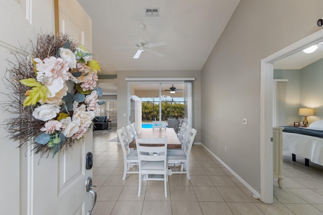 4135 Dover Dr E, Bradenton, FL 34203 - dining space with a ceiling fan, light tile patterned flooring, lofted ceiling, and baseboards