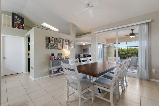 4135 Dover Dr E, Bradenton, FL 34203 - dining space featuring ceiling fan, vaulted ceiling, light tile patterned floors, and baseboards