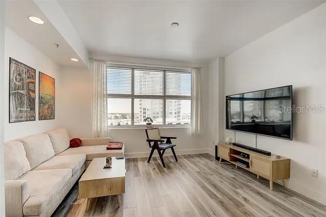 living room with light hardwood / wood-style flooring