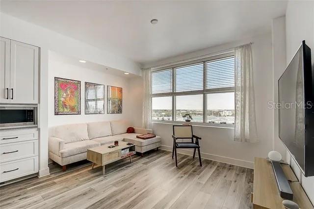 living room with light hardwood / wood-style floors