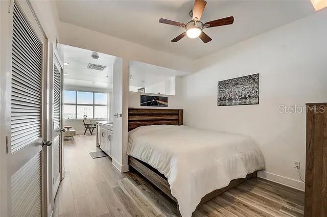 bedroom featuring ceiling fan and light wood-type flooring