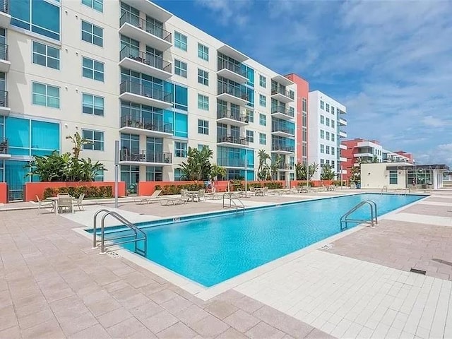 view of swimming pool with a patio area