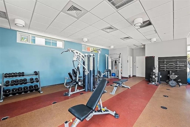 exercise room featuring a drop ceiling