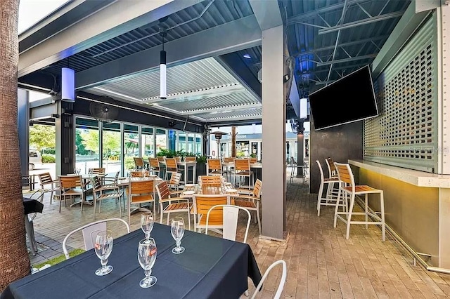 dining space featuring hardwood / wood-style flooring and a healthy amount of sunlight