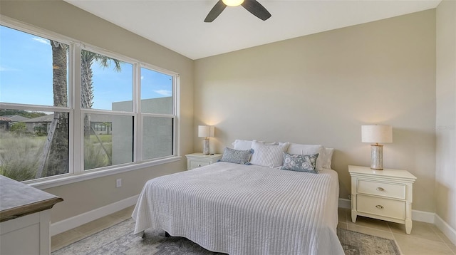 tiled bedroom with ceiling fan