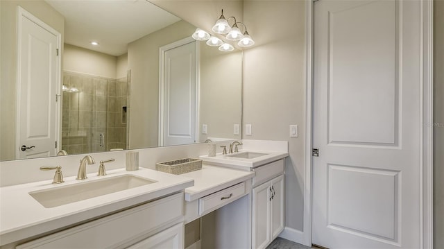 bathroom with vanity and a shower with door