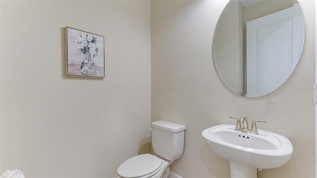 bathroom with sink and toilet