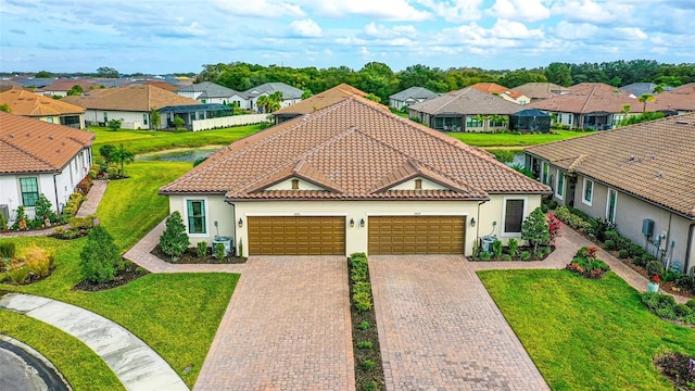 5431 Taliaferro Ct, Palmetto, FL 34221 - mediterranean / spanish home featuring a residential view, a garage, stucco siding, and a tiled roof