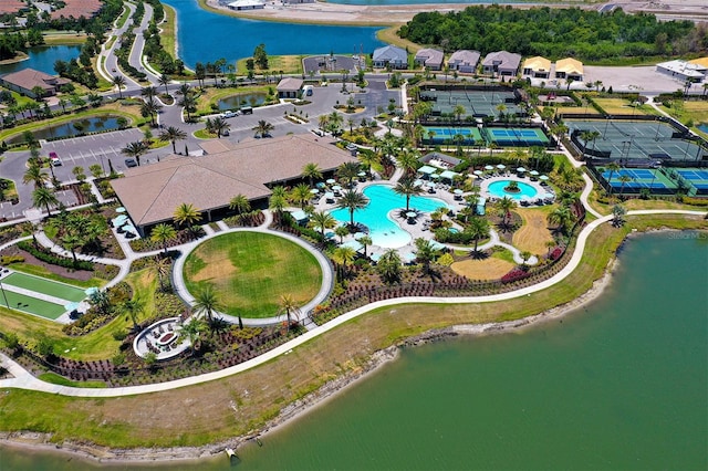 birds eye view of property with a water view