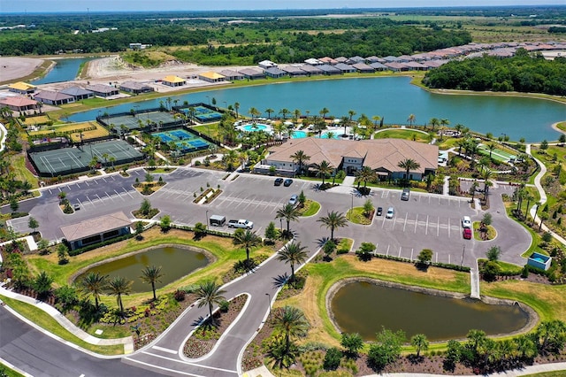 birds eye view of property with a water view