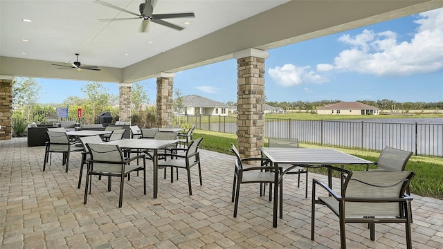 5431 Taliaferro Ct, Palmetto, FL 34221 - view of patio featuring outdoor dining area, a fenced backyard, a water view, and ceiling fan