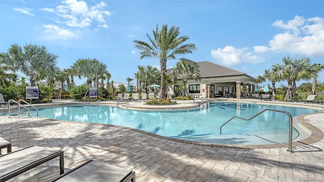 view of swimming pool featuring a patio area