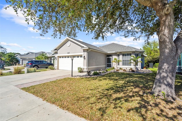 ranch-style home featuring a front yard and a garage