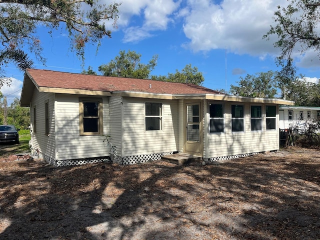 back of property featuring entry steps