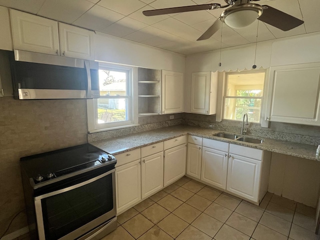 kitchen with appliances with stainless steel finishes, a sink, and white cabinets