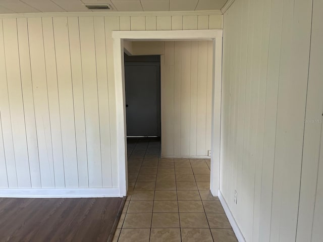 hall with visible vents and tile patterned floors