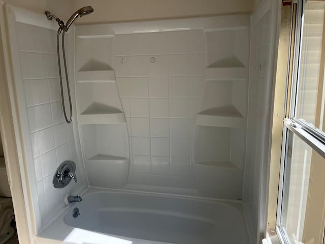 bathroom featuring washtub / shower combination