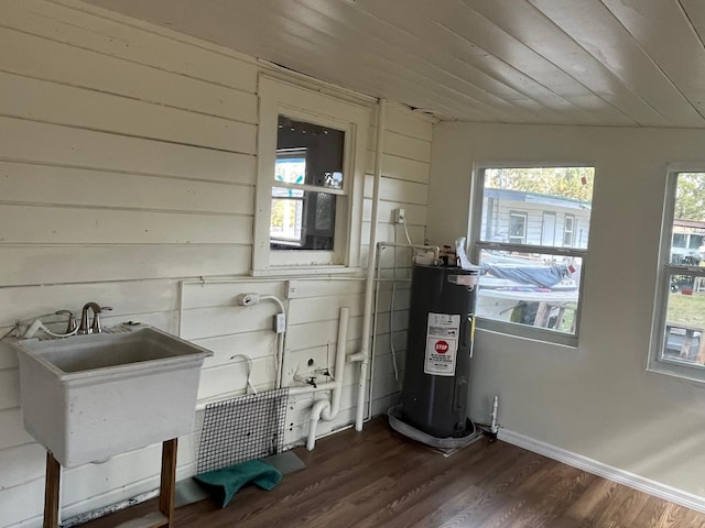 utilities with electric water heater and a sink