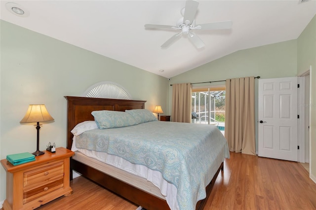 bedroom with access to exterior, ceiling fan, light hardwood / wood-style flooring, and vaulted ceiling