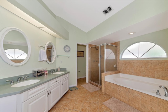 bathroom with a bath, visible vents, a stall shower, and a sink